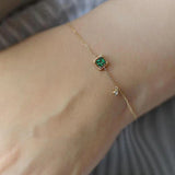 Brazalete en oro con cristal verde