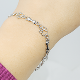Pulsera con Patas de Perro Colgantes y Huesos de Plata Sostenible, Edición Limitada