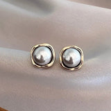 Elegantes pendientes de perla negra