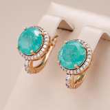 Elegantes aretes de oro con turquesa y ópalo