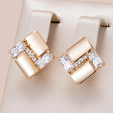 Pendientes geométricos elegantes con zirconia en oro