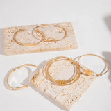 Conjunto de joyería elegante con nudos