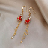 Pendientes festivos con margaritas azules