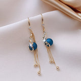 Pendientes festivos con margaritas azules