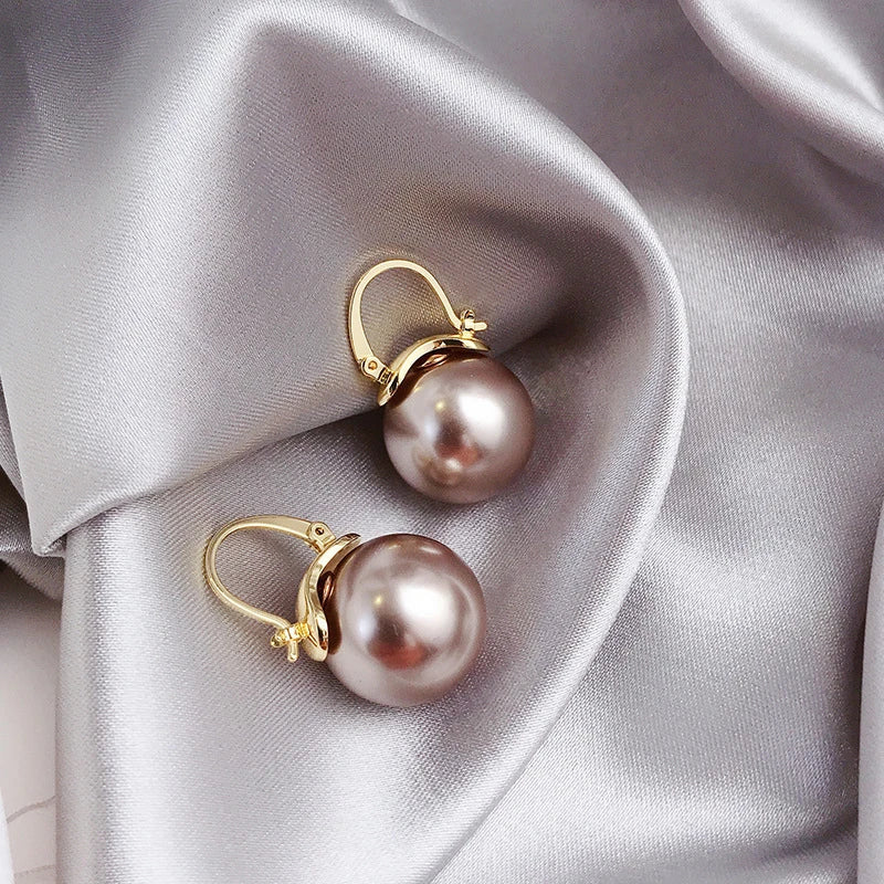 Pendientes dorados con margaritas