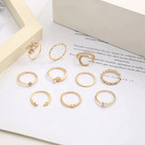 Conjunto de 10 anillos auxiliares adornados con plata y oro
