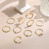 Conjunto de 10 anillos auxiliares adornados con plata y oro