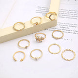 Conjunto de 10 anillos auxiliares adornados con plata y oro
