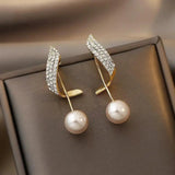 Pendientes dorados con margaritas