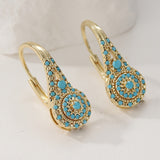 Pendientes de oro con clúster de turquesa