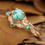 Conjunto de anillos dorados con turquesa