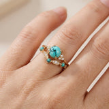 Conjunto de anillos dorados con turquesa