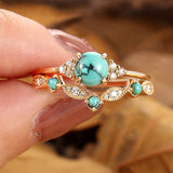 Conjunto de anillos dorados con turquesa