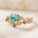 Conjunto de anillos dorados con turquesa