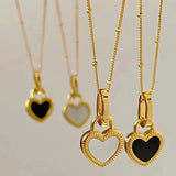 Collar con colgante en negro y blanco corazón en oro