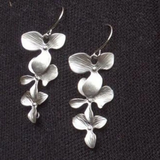 Collar y aretes en forma de flor de plata