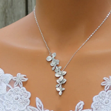 Collar y aretes en forma de flor de plata