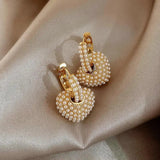 Pendientes de perlas de amor en oro