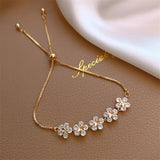 Pulsera de margaritas de cristal en oro