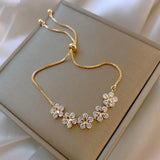 Pulsera de margaritas de cristal en oro