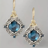 Pendientes de cristales azules en oro y plata
