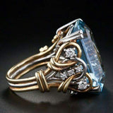 Anillo Retro-Dorado con capas de zirconitas azules