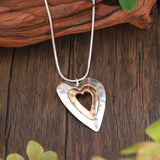 Collar retro con colgante en plata y oro en forma de corazón