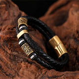 Pulsera de cuero negro trenzada con colgante de oro
