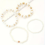 Pulseras de perlas blancas