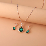 Conjunto de collar y pendientes de cristal verde y oro