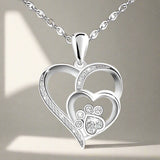 Collar de plata con pata y corazón con circonitas