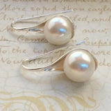 Pendientes en forma de gota con margaritas