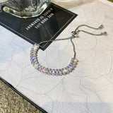 Pulsera ajustable de circonita en oro y plata