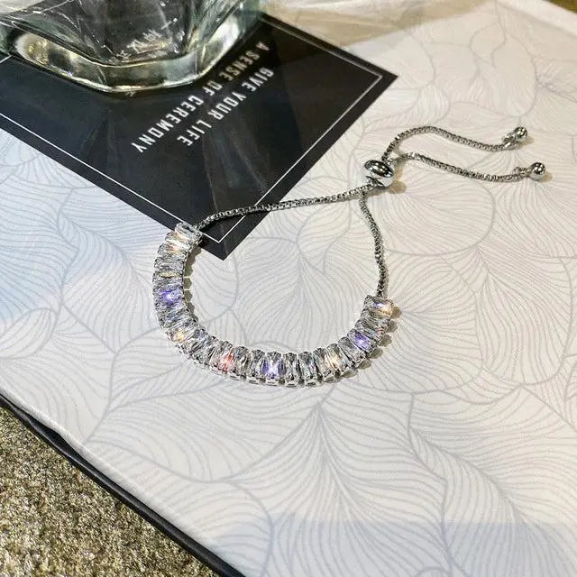 Pulsera ajustable de circonita en oro y plata