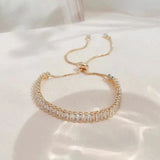 Pulsera ajustable de circonita en oro y plata