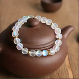 Pulsera de confianza con margaritas y piedra lunar