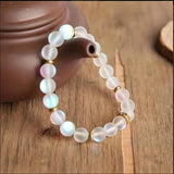 Pulsera de confianza con margaritas y piedra lunar
